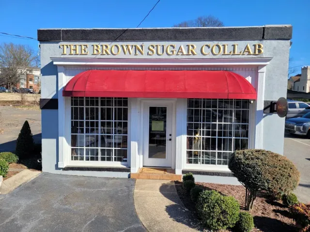 Individual gold letters above Brown Sugar Collab’s red awning.